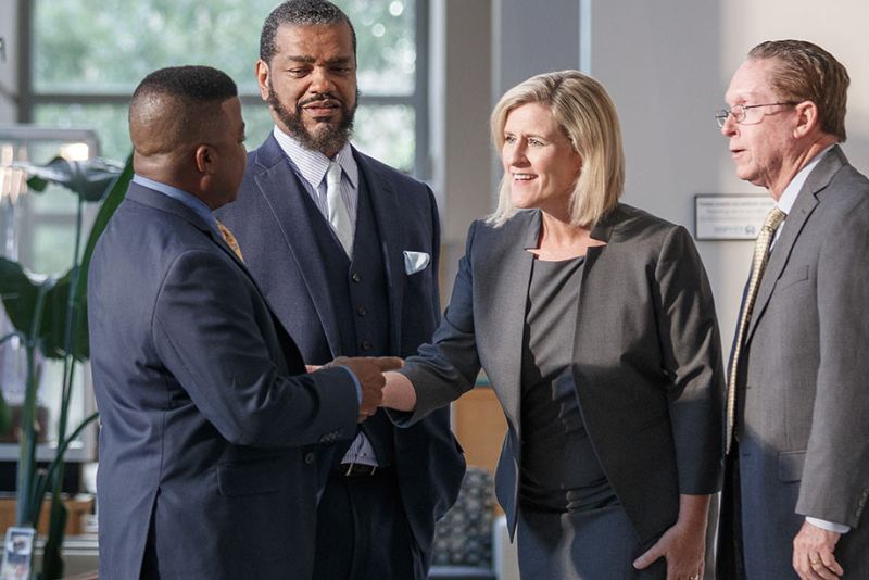 Business professionals shaking hands