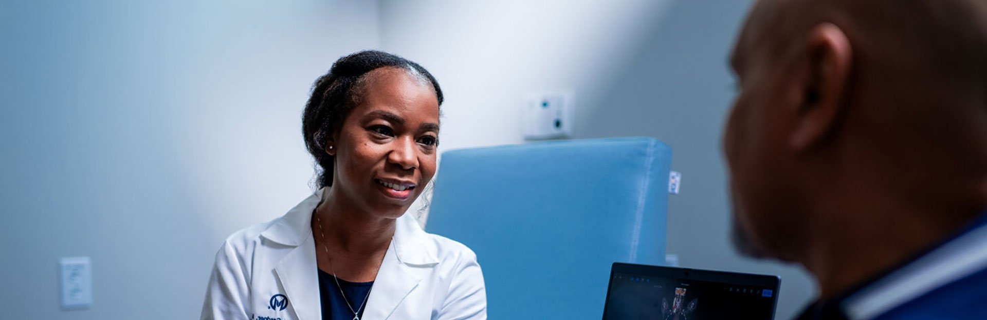 doctor speaking with patient