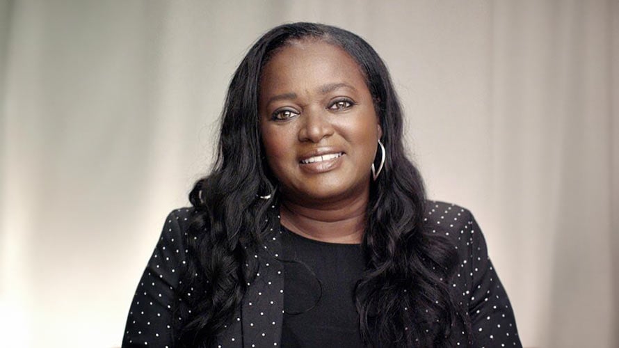 Benita, breast cancer survivor, smiling for the camera.