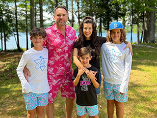 Jeanine with her husband and sons