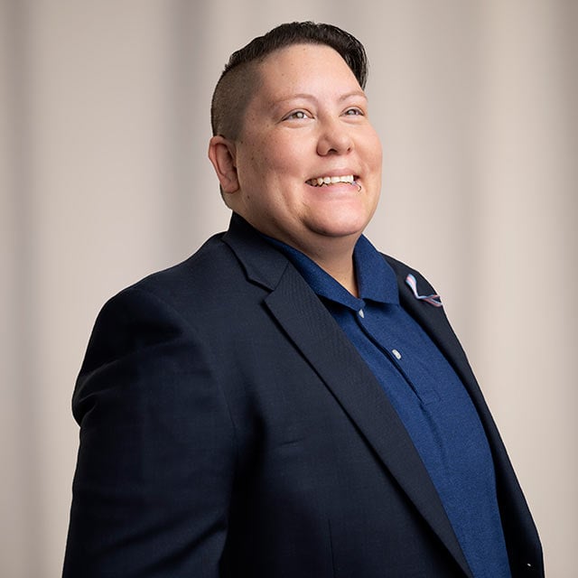 Cervical cancer survivor smiles and poses for a photo.