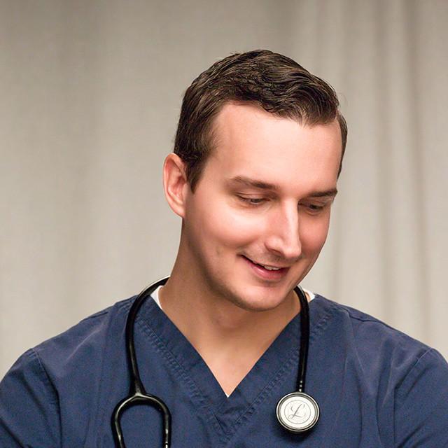 Thoughtful headshot of Keith, Assistant Patient Care Manager at Moffitt Cancer Center