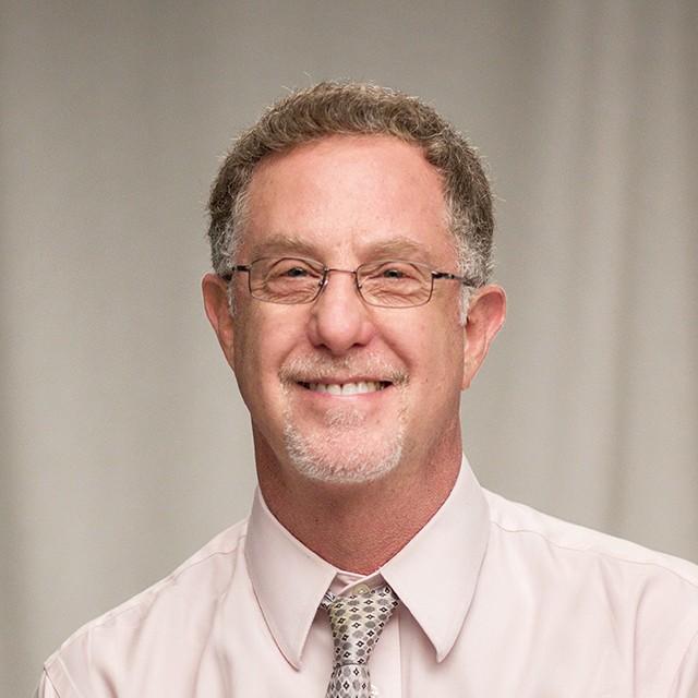 Headshot of Lloyd smiling