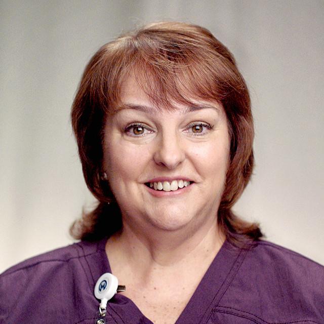 Lori, Moffitt nurse and kidney cancer survivor, smiling for the camera.