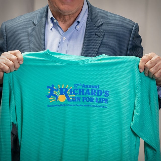 Richard holds a Richard's Run for Life t-shirt