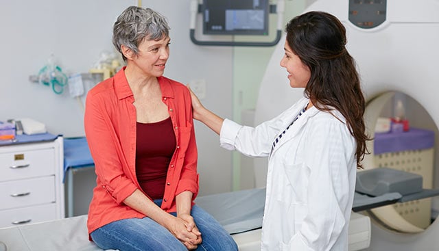 Physican consults with patient.