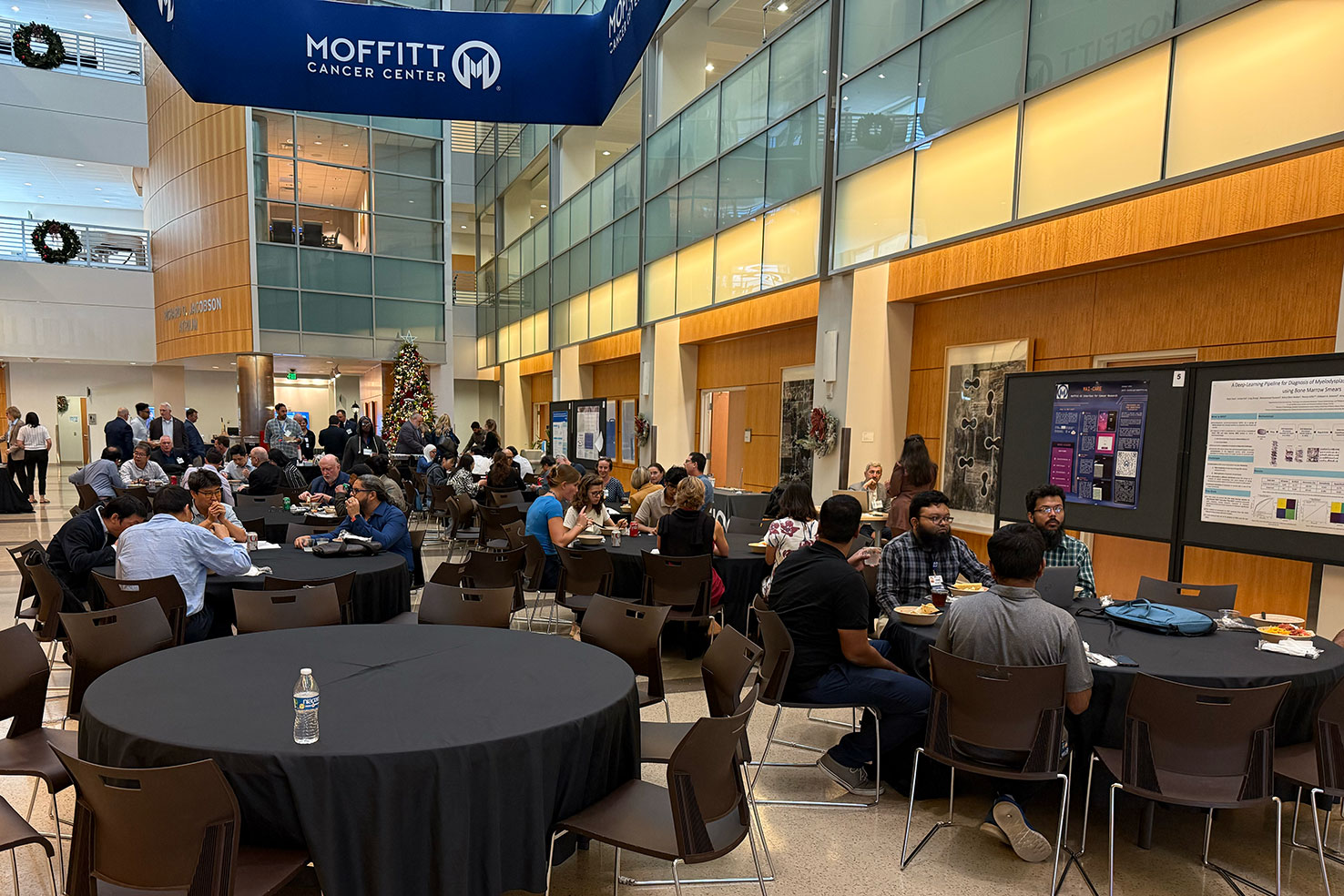 conference participants sit at tables