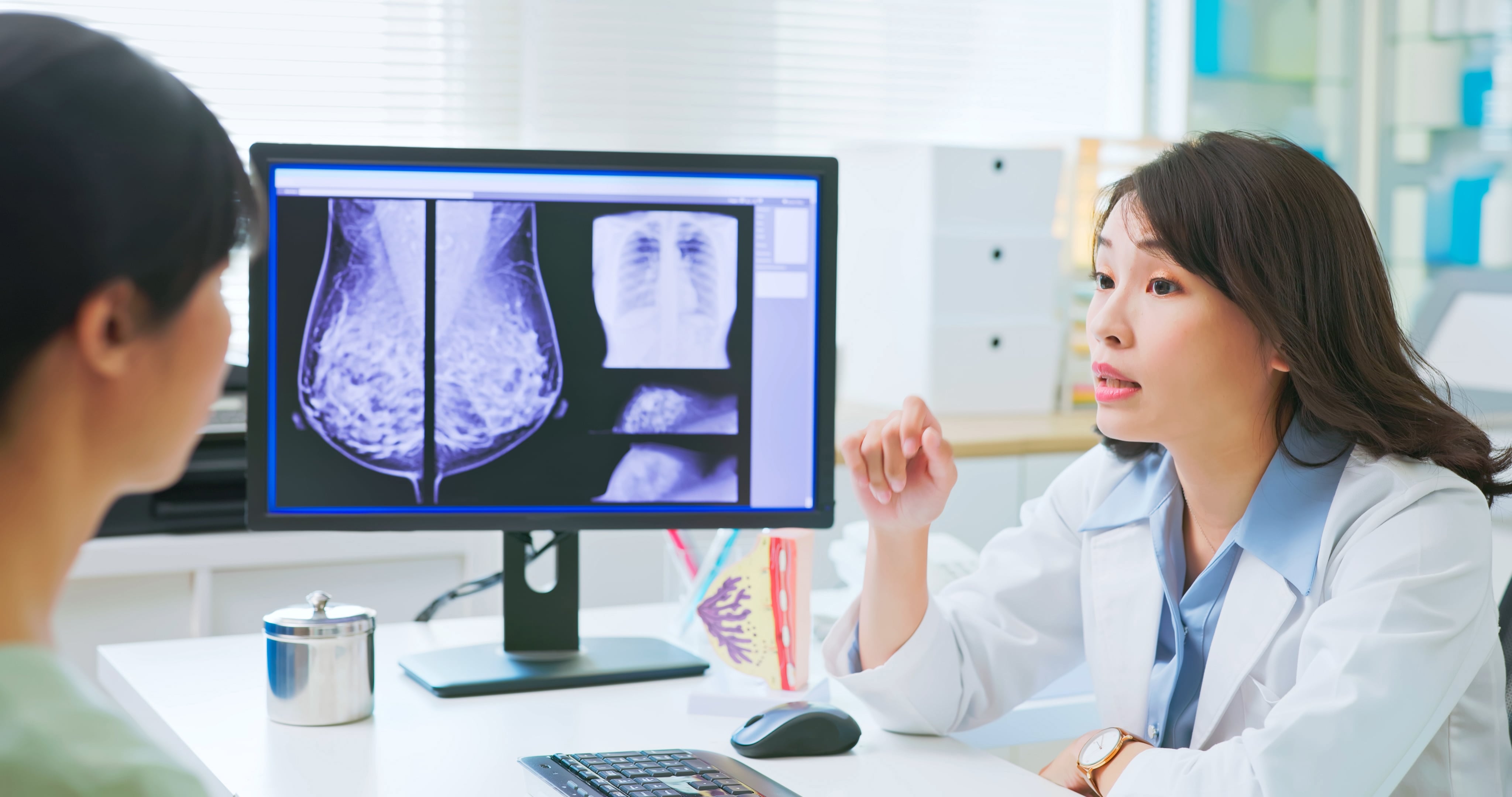 Woman talking to her doctor about breast cancer
